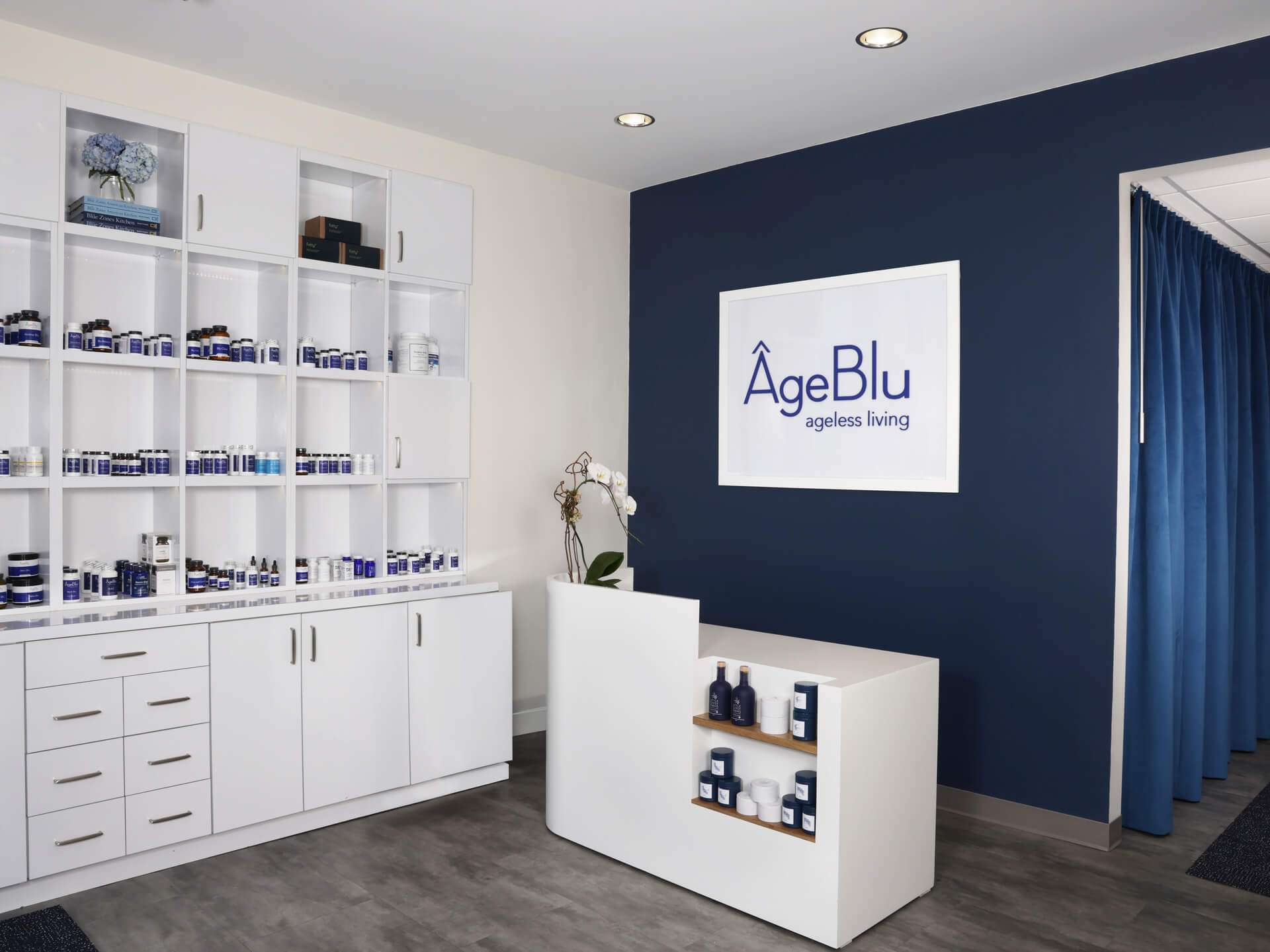 The retail space of the Ageblu clinic showing a shelf of supplements