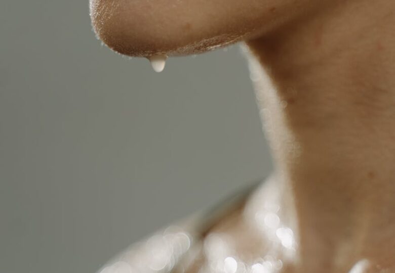 close up photo of a woman sweating